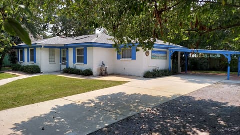 Carport adjacent to kitchen door.