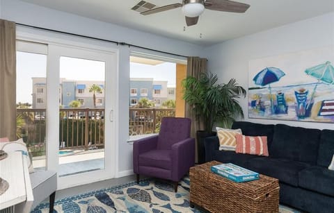 Cozy living room with full size pull out sofa. This unit overlooks the resort pool