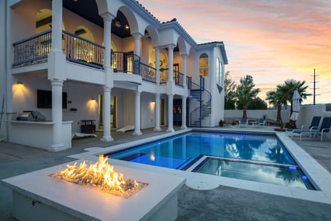 Sunset with cotton candy skies over the amazing pool and fire pit. 