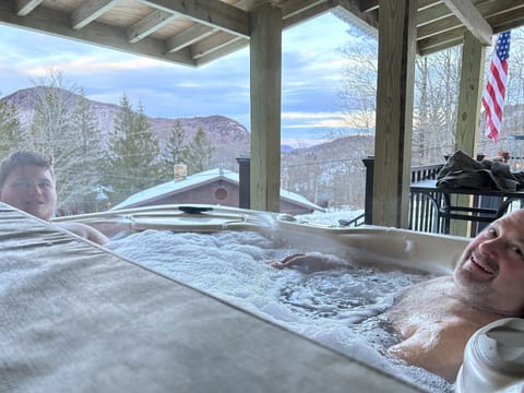 Hot tub on deck under cover with great views