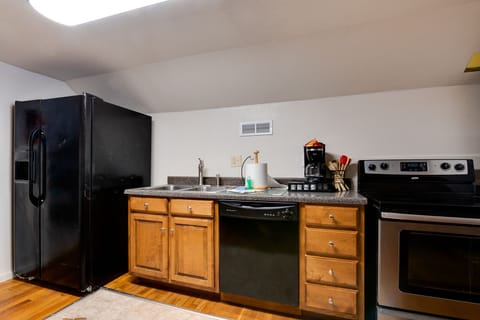 Full size Refrigerator with Ice Maker.  Dishwasher & Stove, full size.