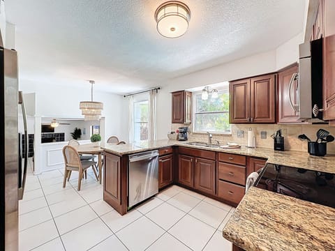 Kitchen w/ Granite Countertops and Stainless appliances