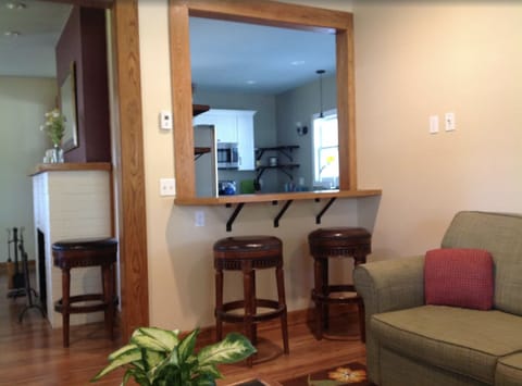 Large Living Room and Seating Bar Connects to Spacious Dining Room and Kitchen