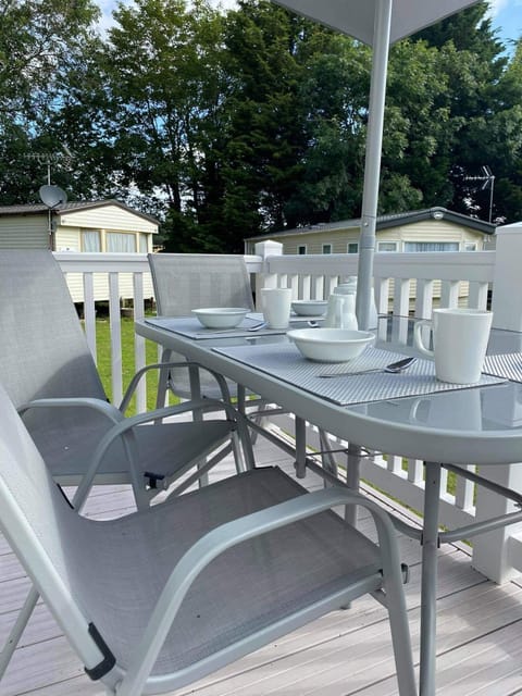 Outside dinnn in my table and chairs with umbrella