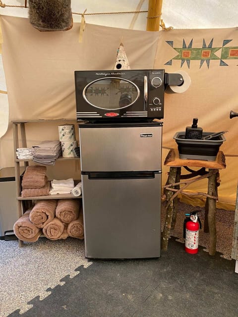 Mini fridge, microwave and storage.