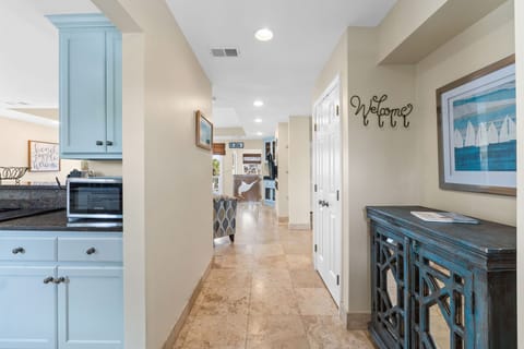 Step into Captain Jax through a bright, inviting entryway featuring coastal decor, natural light, and warm tones that set the stage for your beachside retreat.
Professionall Managed by
Breathe Easy Rentals