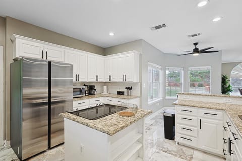 Spacious Gourmet Kitchen with Granite Countertops & Modern Appliances