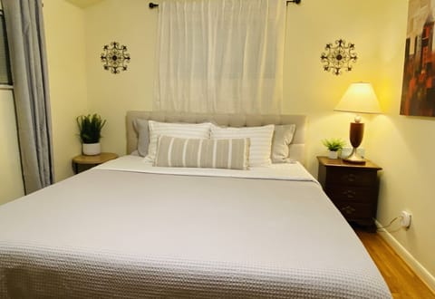 Bedroom # 2: King bed with ceiling fan and UHD smart TV