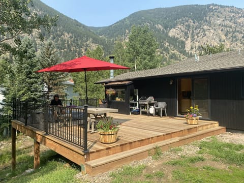 Large deck off yard. View of mountains in every direction