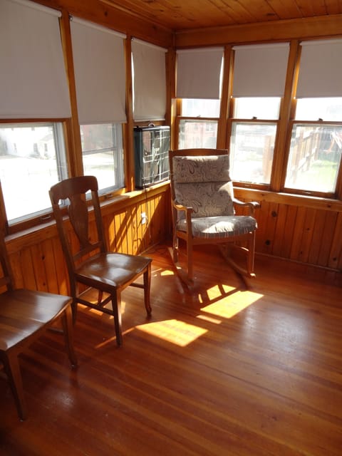 Beautiful wooden sun porch OK for a blow up mattress.