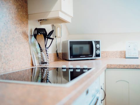 Kitchen area | Seascape Cottage - Celtic Haven Resort, Lydstep, near Tenby