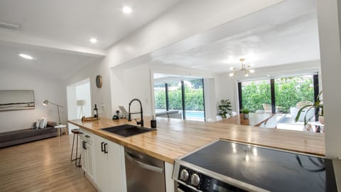 Beautiful butcher block counter for extra sitting and cooking