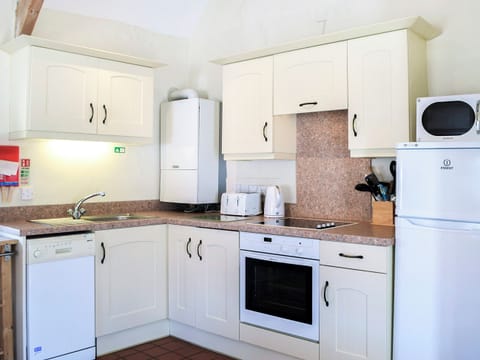 Kitchen area | Dovecotes - Celtic Haven Resort, Lydstep, near Tenby