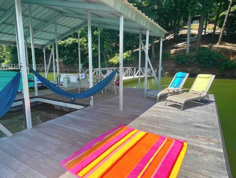 Spacious dock with room to spread out in the sun or under cover. Swim-up bench!