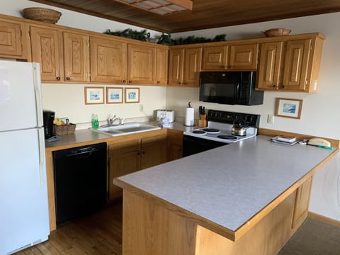 Kitchen with dish ware and cooking ware