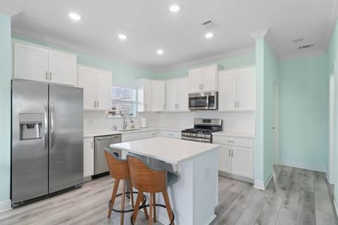 Fully equipped kitchen including grill tools.