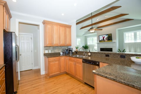 Kitchen with large counter space open to living room. 