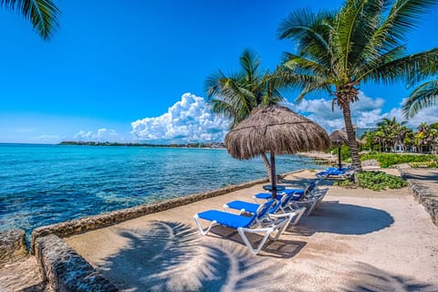 Sirena unit 18 - Beach area with shade palpas and lounge chairs