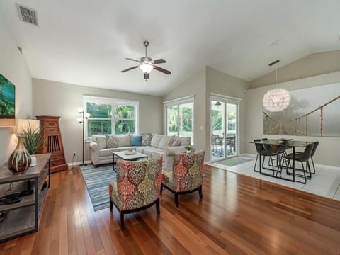 Main living area has hardwood floors and tile. Sliding doors to the patio.
