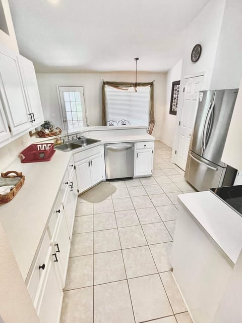 Stainless steel appliances and place setting for eight.