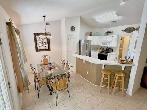Seating for six in the breakfast room. More seating I. The sunroom.