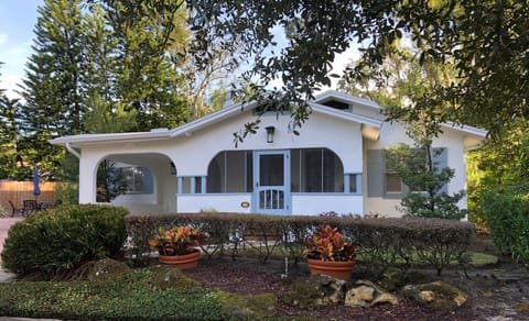 House with side patio, patio table, chairs/umbrella and gas grill(not shown)