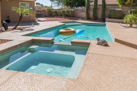 Large backyard area w/ patio seating, swimming pool and spa, and BBQ. Pool and spa heating optional,  fee required 