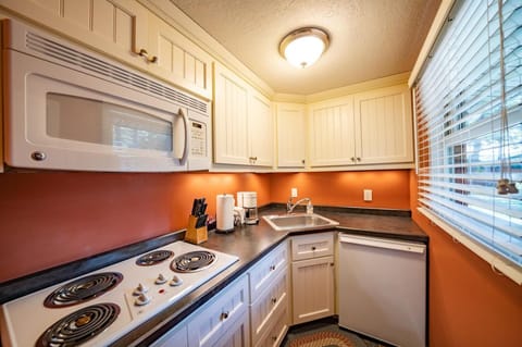 Guest house kitchenette with refrigerator, stove, microwave and toaster oven