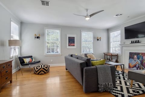 Living room features a sectional sofa & large screen smart tv. (Note, sofa has changed since photo - it is larger and seat more guests comfortable).