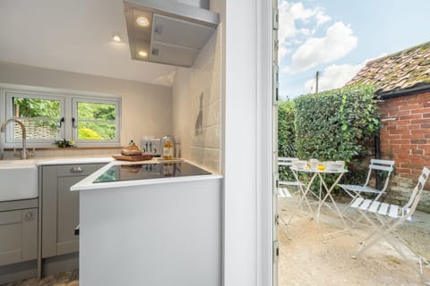 Ground floor: Patio dining just outside the kitchen