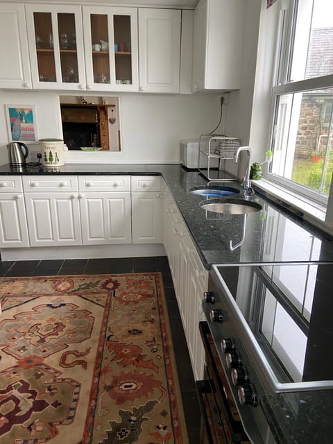 The kitchen with all the utensils for cooking.