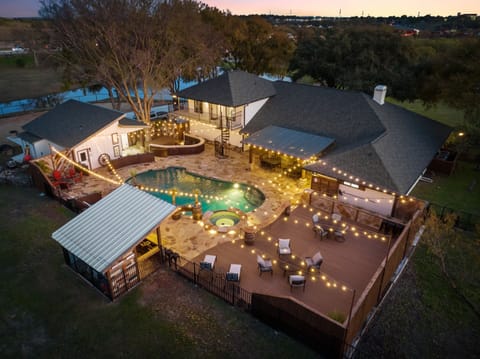 Birds eye view of property at dusk
