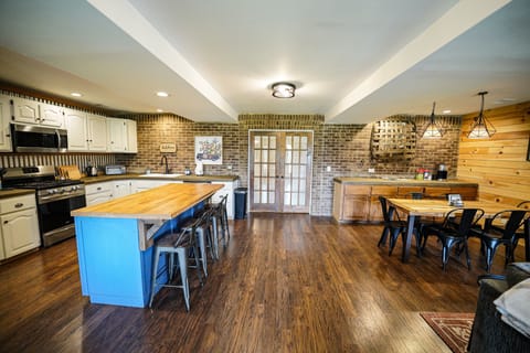 Main living area with door leading to the main level master bedroom