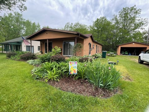 Front deck and garage holds grill, chairs and games.