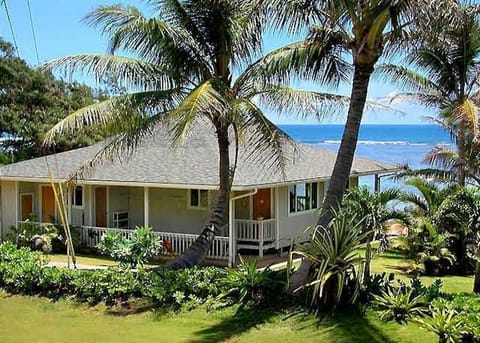 Hawaiian style beach house with vaulted ceilings and a huge Lanai on the beach!