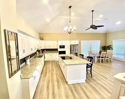 Spacious open kitchen with views of the water, perfect for entertaining.