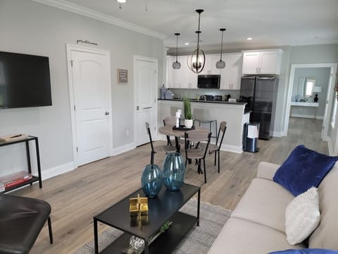 Living room/ Dining Room with kitchen in background 