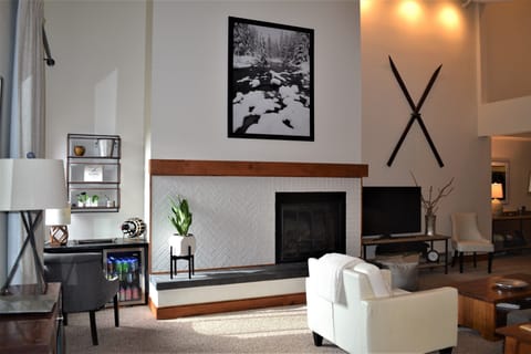 Living room with high ceilings, new sofa and 55" Smart TV