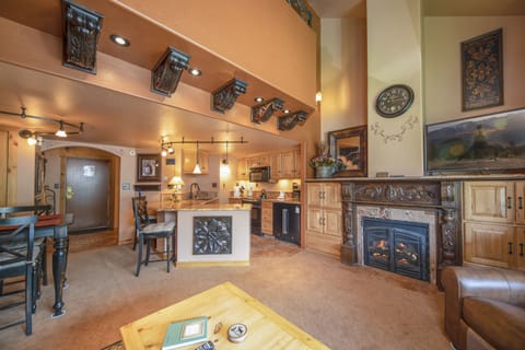 Main level living area with smart TV and gas fireplace.