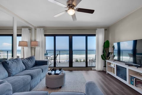 Living room area with sleeper sofa and gulf view.