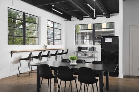Seating for 6 at the dining table, plus 6 barstools along the kitchen's coffee bar.
