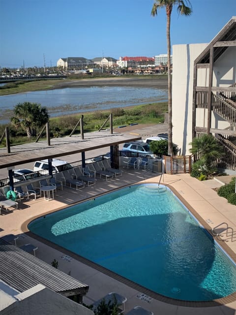 View of Pool from Condo Stairwell