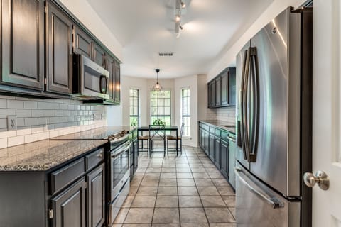 Cook your fav meals in a large kitchen stocked w/ plenty of serve & cookware