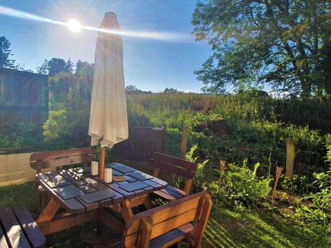 Picnic bench and seating for up to 8 people, with gated access to adjoining wild pasture | Meadows End - Meadowcroft Cottages - Meadowcroft Cottages, near Bowness-on-Windermere