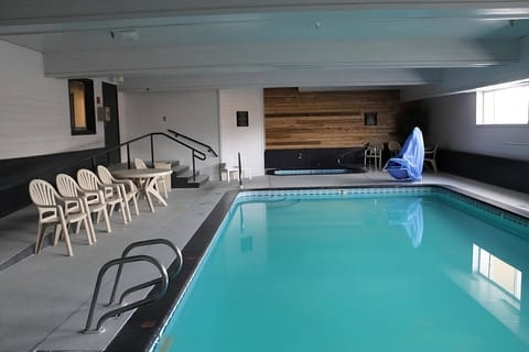 Lounge poolside with plenty of seating for your group.