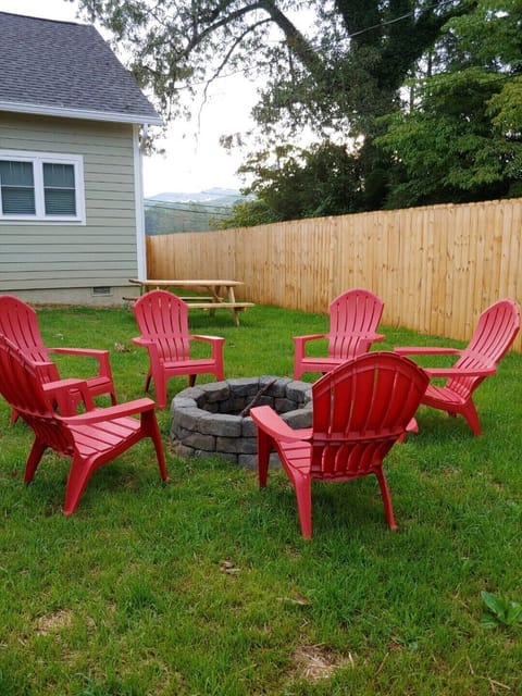 Fire pit with seating for 6 surrounding it.

Picnic table in background. 