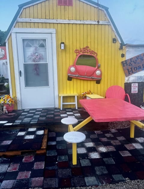 She Shed with a comfortable place to eat outside