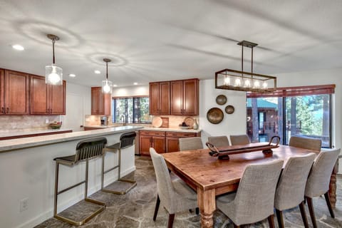 The dining room is open to the kitchen with a breakfast bar that seats two