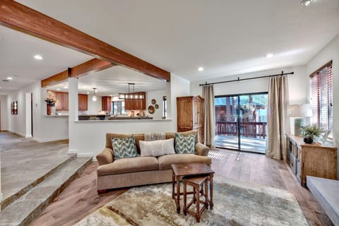 Access to deck is off the den