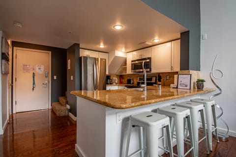 Fully Stocked Kitchen with Stainless Steel Appliances